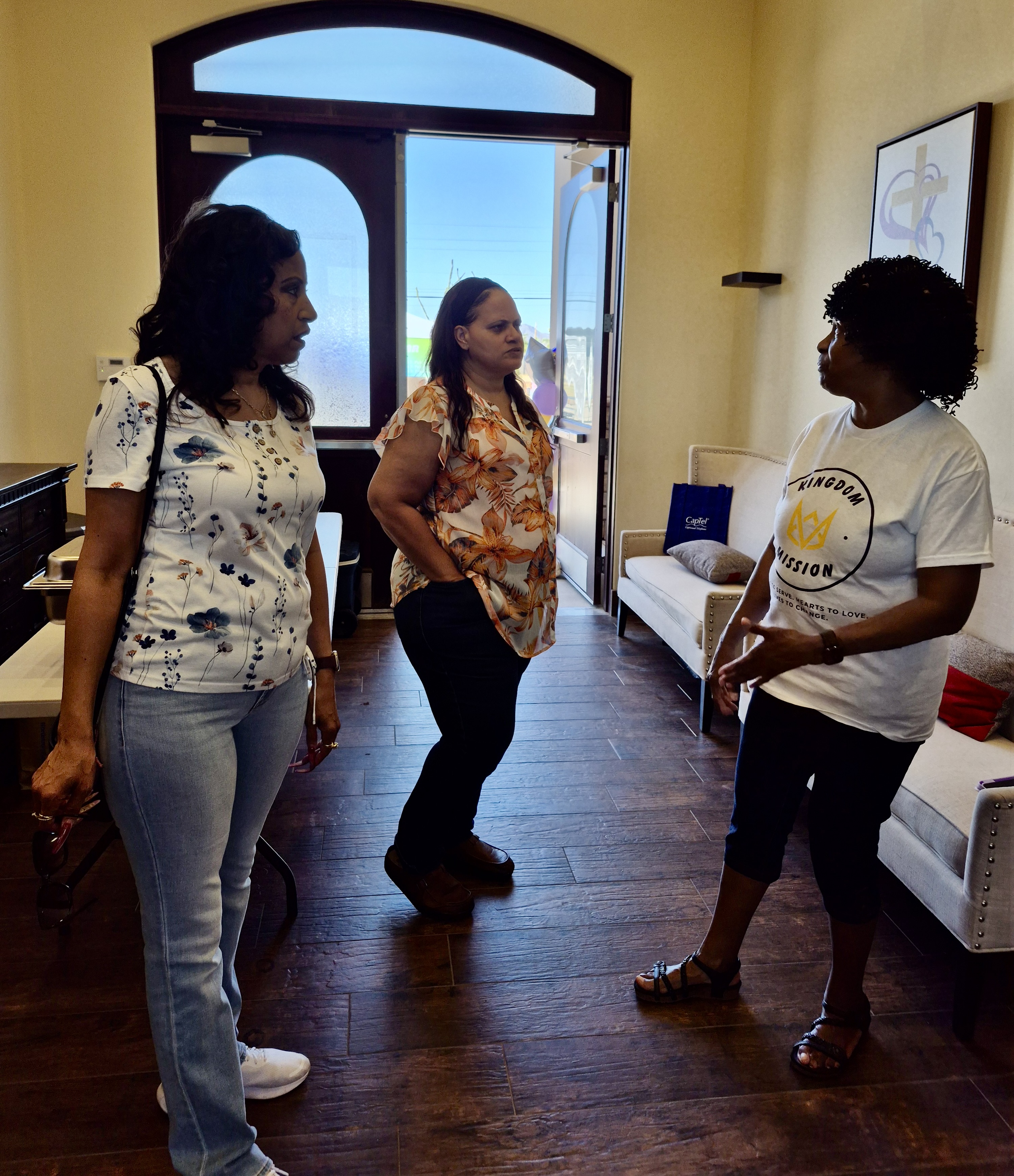 Dr. Marilyn Riley, Ph.D., Board Member, welcoming Sylvia Beatty, Pastor, Heart of Promises Ministries, and community member at Kingdom Mission's 2025 Community Health Fair.